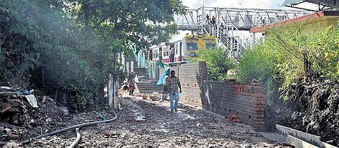 The pathway leading to Vyasarpadi Jeeva railway station lying in shambles  | Martin Louis
