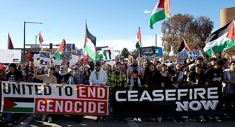 Demonstrators march down Colfax Avenue during a rally in support of Palestinians in Denver. (Photo | AFP)