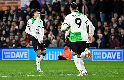 Liverpool's Colombian midfielder #07 Luis Diaz celebrates after scoring the equalising goal during the English Premier League football match between Luton Town and Liverpool. (Photo | AFP)