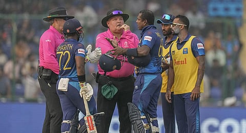 Sri Lanka's Angelo Mathews talks to umpires after he was declared timed out during the World Cup match against Bangladesh in New Delhi. (Photo | AP)