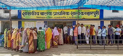 Voters wait in a queue to cast their votes for the 1st phase of Chhattisgarh Assembly elections, at a polling station in Rajnandgaon district, Tuesday, Nov. 7, 2023. (Photo | PTI)