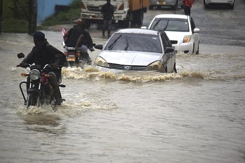 FILE - Motorists wade through a flooded road in Mombasa town after a heavy downpour on Friday Nov.3, 2023. (Photo | AP)