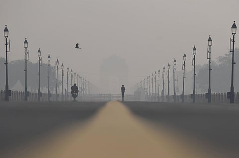 A view of Kartavya Path amid a smog condition as the AQI level increases to a 'very poor' category, in New Delhi on Tuesday. (Photo | ANI)