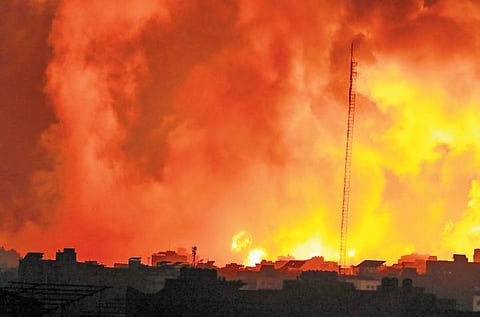 Fire and smoke rises from buildings following Israeli airstrikes on Gaza City. (Photo | AP)
