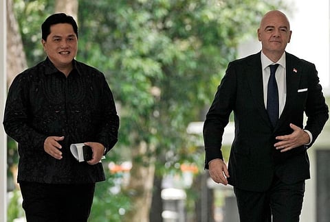 FILE - FIFA President Gianni Infantino, right, walks with Minister for State Owned Enterprises Erick Thohir upon arrival for a meeting with Indonesian President Joko Widodo. (Photo | AP)