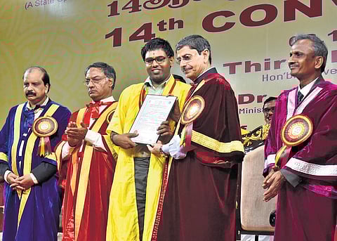 Governor RN Ravi hands over certificate to a visually-challenged student during the 14th convocation of Tamil Nadu Open University on Wednesday | P Jawahar