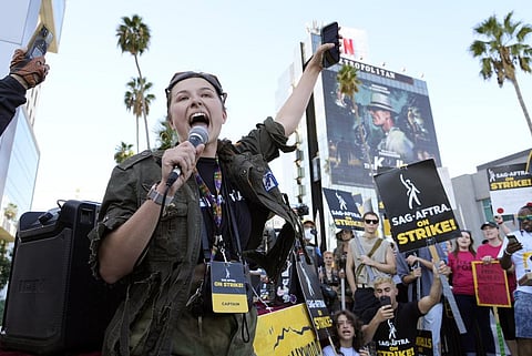 SAG-AFTRA captain Mary M. Flynn rallies fellow striking actors on a picket line outside Netflix studios, Wednesday, Nov. 8, 2023, in Los Angeles. (AP)