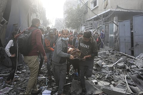 Palestinians evacuate wounded in Israeli bombardment Rafah, Gaza Strip, Friday, Dec. 1, 2023. (Photo | AP)
