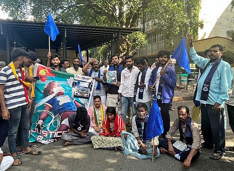 Deceased toddler Ajay’s family members and ambulance drivers protest at NIMHANS on Thursday | Express