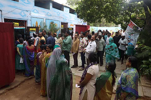 Voters wait in long queue at a polling booth at Goshamahal constituency, Telangana. (Photo | Sri Loganathan Velmurugan)