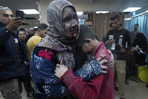 Palestinians wounded in the Israeli bombardment of the Gaza Strip are brought to the hospital in Deir al Balah on Friday, Dec. 8, 2023. (Photo | AFP)