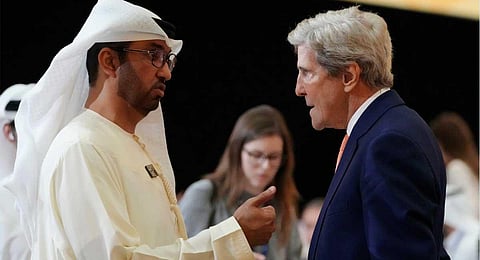 COP28 President Sultan al-Jaber and John Kerry, U.S. Special Presidential Envoy for Climate, speak as they attend a meeting at the COP28 U.N. Climate Summit, Sunday, Dec. 10, 2023, in Duba (AP)