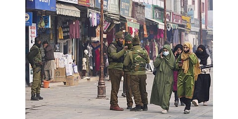 Security personnel stand guard at Lal Chowk after the Supreme Court upheld the Centre's decision to abrogate Article 370 of the Constitution, in Srinagar. (Photo | PTI)