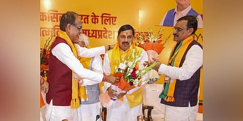 BJP MLA from Ujjain South Mohan Yadav being greeted by Madhya Pradesh CM Shivraj Singh Chouhan and state President VD Sharma on his election as the BJP's legislature party leader in MP. (Photo | PTI)