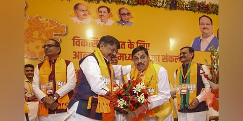 BJP MLA from Ujjain South Mohan Yadav being greeted by party leader Kailash Vijayvargiya after being elected as the BJP's legislature party leader, in Bhopal. (Photo | PTI)