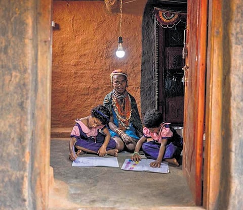 Sukra Muduli with her ganddaughters in her home on Bonda hills under Khairput block of Malkangiri district I Special Arrangement