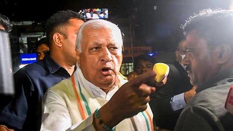 Kerala Governor Arif Mohammed Khan reacts after being allegedly mobbed by SFI students on his way to the airport, in Thiruvanathapuram, Monday, Dec. 11, 2023.