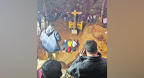 Rescue teams working at the bore-well pit.