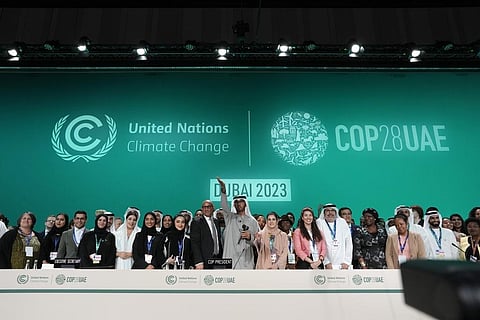 Officials pose for photos at the end of the COP28 UN Climate Summit, Wednesday, Dec. 13, 2023, in Dubai, UAE. (AP Photo)