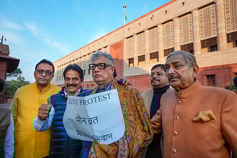 Suspended TMC MP Derek O' Brien and others during his silent protest outside the Parliament House during the Winter session, in New Delhi, Thursday, Dec. 14, 2023. (Photo | PTI)