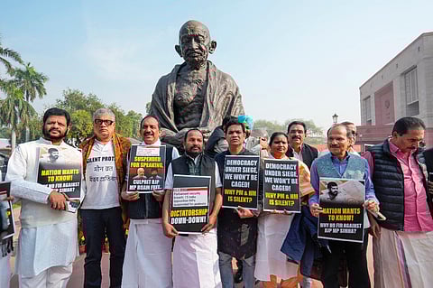 Congress MP Adhir Ranjan Chowdhury with suspended MPs VK Sreekandan, Derek O'Brien, TN Prathapan, Hibi Eden, Ramya Haridas and others at a protest in Parliament complex. (PTI Photo)