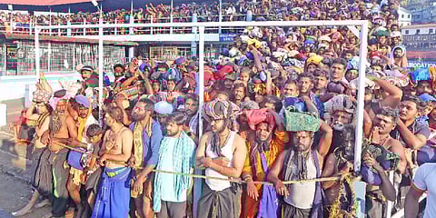Pilgrims waiting for darshan near Sreekovil at Sannidhanam in Sabarimala Lord Ayyappa temple on Thursday.