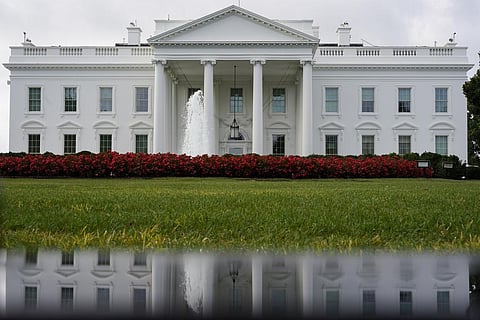 FILE - The White House is seen reflected in a puddle, Saturday, Sept. 3, 2022, in Washington. (AP Photo)