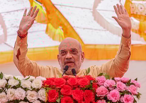 Union Home Minister Amit Shah speaks during 'Viksit Bharat Sankalp Yatra', on the outskirts of Ahmedabad, Saturday, Dec. 16, 2023. (PTI Photo)