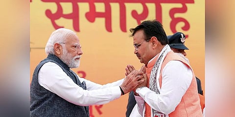 Prime Minister Narendra Modi being greeted by new Rajasthan Chief Minister Bhajan Lal Sharma during the latter's swearing-in ceremony, in Jaipur. (Photo | PTI)