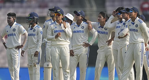 ndian players wait for a DRS decision during the third day of the one-off Test cricket match between India and England. (Photo | PTI)