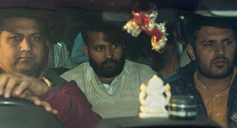 Lalit Jha (C), key accused in the recent Parliament security breach, being produced at the Patiala House Court, in New Delhi, Friday, Dec. 15, 2023. (PTI)