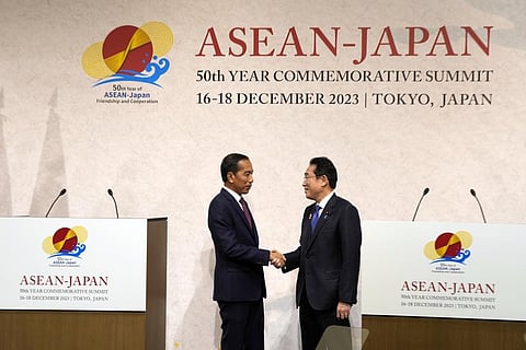 Indonesian President Joko Widodo (L) and Japan's Prime Minister Fumio Kishida shake hands following the ASEAN-Japan Commemorative Summit in Tokyo, Dec. 17, 2023. (AP Photo)