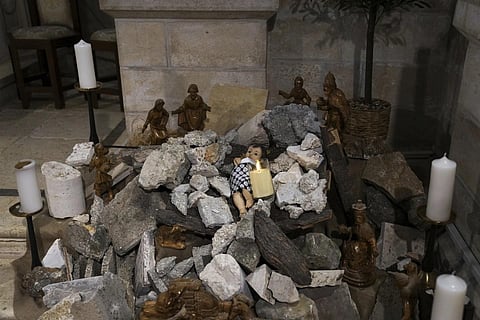 An installation of a scene of the Nativity of Christ with a figure symbolising baby Jesus lying amid the rubble, in reference to Gaza...(Photo | AP)