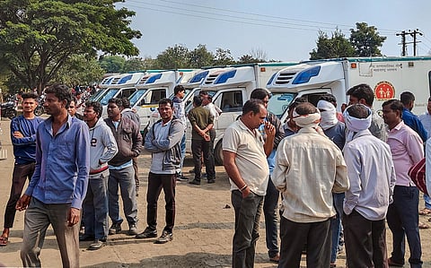 Workers and locals outside a manufacturing unit of Solar Industries after a blast occurred at the factory, at Bazargaon near Nagpur, Sunday, Dec. 17, 2023. (Photo | PTI)