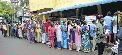 People seen queuing up to get the application form to receive the cyclone relief at Chrompet in Chennai on Sunday | Ashwin Prasath
