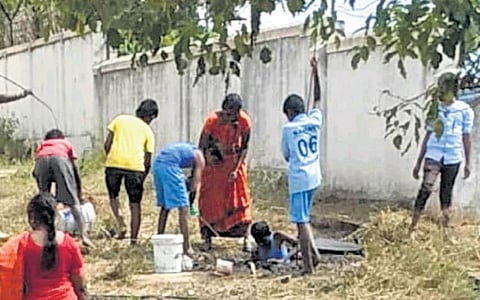 Students cleaning a septic tank at Morarji Desai Residential School at Yeluvahalli. The incident was reported on December 1