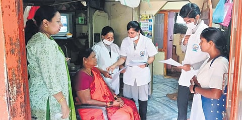 Students of Rajamahendravaram Government Medical College taking notes on a woman’s health as part of NMC’s Family Adoption Programme | Express