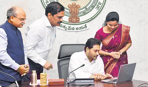 Chief Minister YS Jagan Mohan Reddy launches the upgraded YSR Aarogyasri scheme at his camp office in Tadepalli on Monday. (Photo | Express)