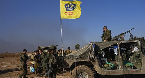 Israeli soldiers are seen at a staging area near the Israeli-Gaza border, in southern Israel, Monday, Dec. 18, 2023.(Photo | AP)