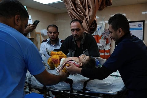 Palestinian child wounded in the Israeli bombardment of the Gaza Strip is brought to al Aqsa Hospital on Deir al Balah | AP