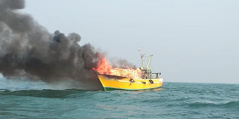 Eleven fishermen from Dummulapeta in Kakinada district were rescued by ONGC and Indian Coast Guard boats when their boat went up in flames following a blast in the boat.
