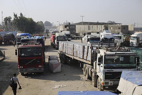 Humanitarian aid trucks enter through the Kerem Shalom crossing from Israel into the Gaza Strip on Monday, Dec. 18, 2023 | AP