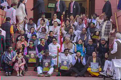 Suspended Opposition MPs protest during the Winter session of Parliament, in New Delhi on Tuesday. (Photo | PTI)