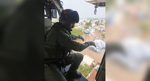 Food packets being dropped from a chopper