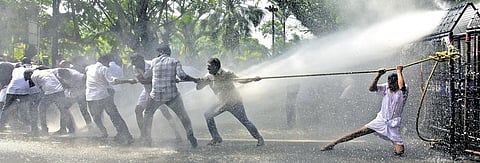 Police use water cannons to disperse Youth Congress workers who staged a protest in front of the Kanayannur taluk office in Kochi on Wednesday | Express