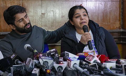 Wrestlers Bajrang Punia and Sakshi Malik address a press conference. (Photo | PTI)