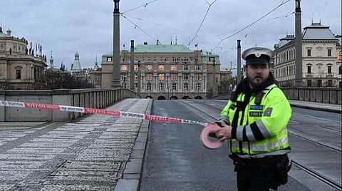 A police officer cordons off an area near the Charles University in central Prague, on December 21, 2023. (Photo | AFP)