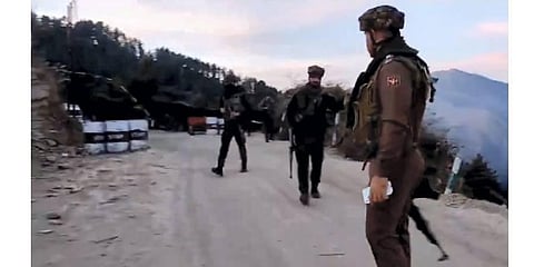 Army personnel stand guard near the site where an Army vehicle was ambushed by terrorists, in Poonch district. (Photo | PTI)