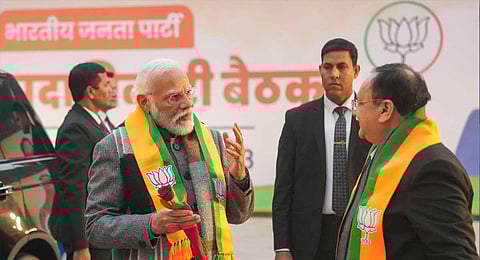 Prime Minister Narendra Modi being welcomed by BJP national president JP Nadda upon his arrival to attend the BJP’s national office-bearers’ meeting at the party headquarters, in New Delhi. (PTI)