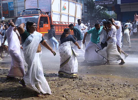 Women Congress activists hurl stones at the police during the Congress protest march led by KPCC president K Sudhakaran in Thiruvananthapuram on December 23, 2023 